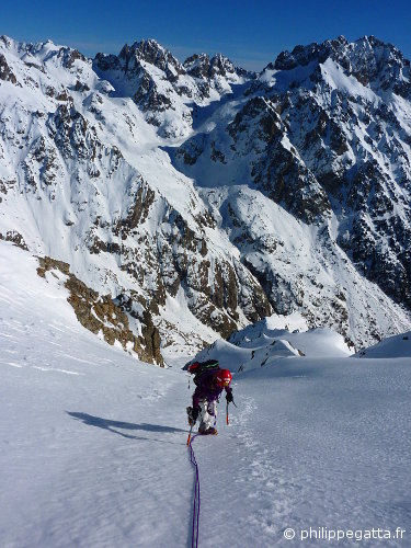Anna in the upper slopes of the East Face of Mont Neiglier. Tete du Basto and Grand Capelet behind (© P. Gatta)